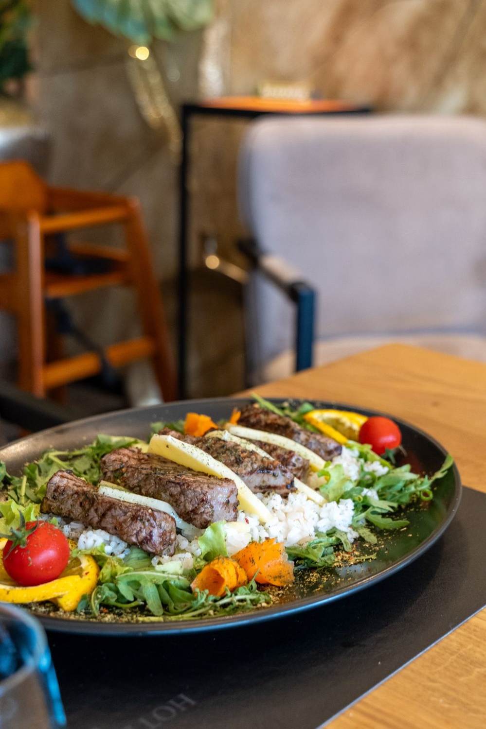 Steak salad in restaurant ambience